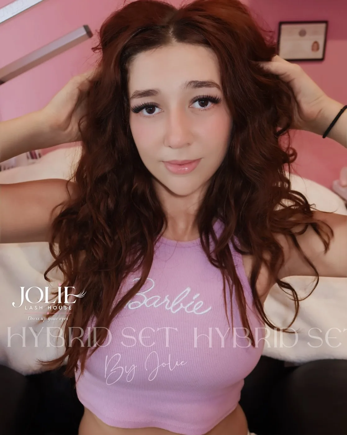 Hybrid lash set by Jolie at Jolie Lash House — client in pink top with full hybrid lashes